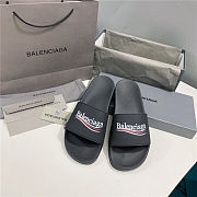 BALENCIAGA Black Logo Wavy Pool Slides - 1